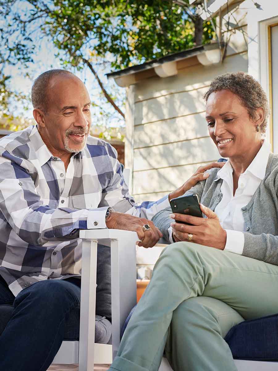 Husband talking to wife about signs of hearing loss